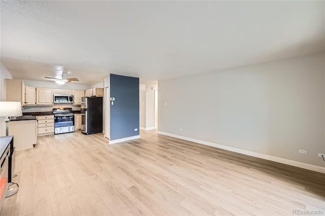 kitchen with ceiling fan, appliances with stainless steel finishes, and light wood-type flooring