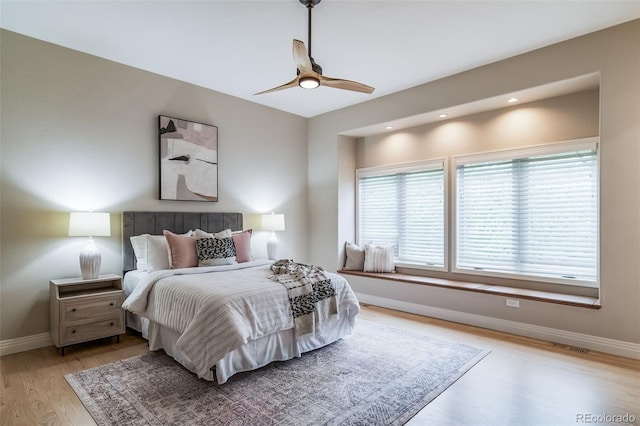 bedroom with baseboards, light wood-style flooring, a ceiling fan, and recessed lighting