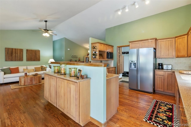 kitchen with stainless steel fridge with ice dispenser, open floor plan, light wood-style flooring, a ceiling fan, and high vaulted ceiling