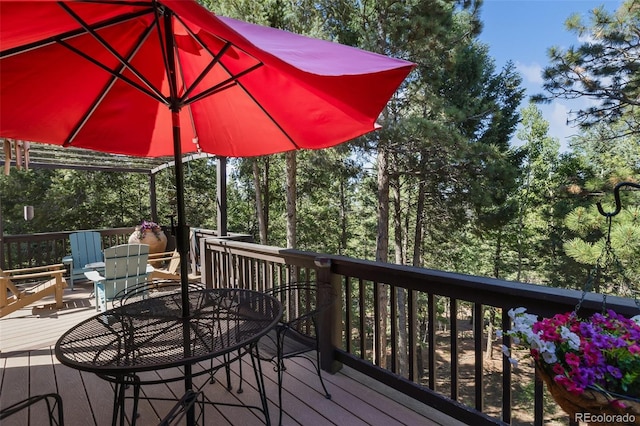 deck with outdoor dining area