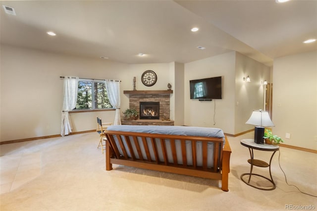 living area featuring light colored carpet, recessed lighting, and a fireplace
