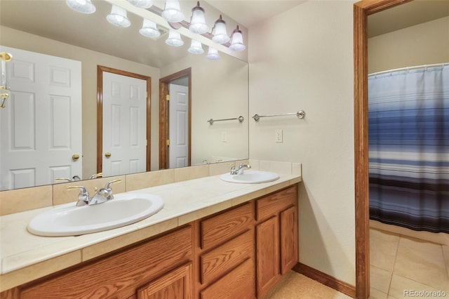 bathroom featuring double vanity and tile patterned floors