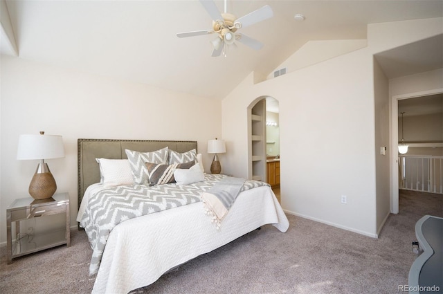 carpeted bedroom featuring visible vents, a ceiling fan, lofted ceiling, baseboards, and arched walkways
