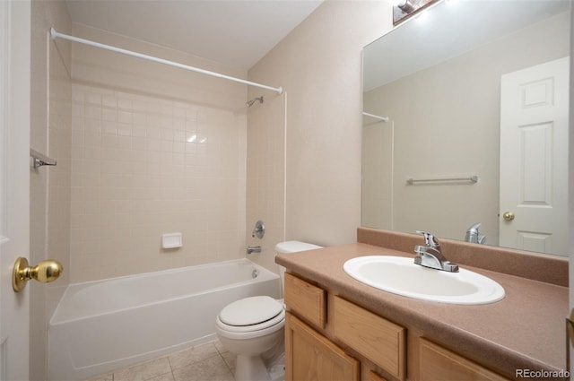 full bath featuring toilet, tile patterned floors, washtub / shower combination, and vanity