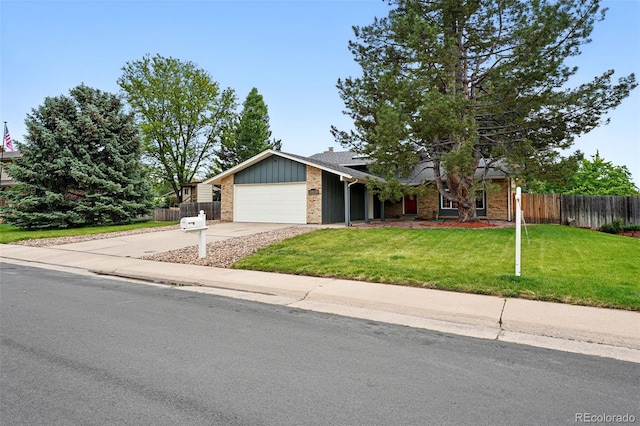 2495 S Lansing Way, Aurora, CO 80014 - view of front facade featuring a garage, brick siding, and driveway