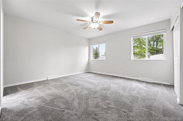 2495 S Lansing Way, Aurora, CO 80014 - spare room featuring ceiling fan, carpet floors, and baseboards