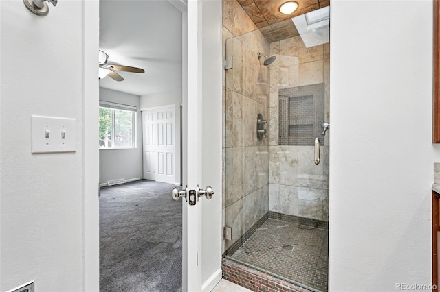 2495 S Lansing Way, Aurora, CO 80014 - full bathroom featuring a stall shower, baseboards, and ceiling fan