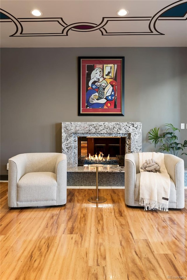 9 Sedgwick Dr, Englewood, CO 80113 - sitting room featuring a fireplace, wood finished floors, and recessed lighting