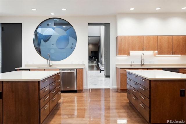 9 Sedgwick Dr, Englewood, CO 80113 - kitchen featuring a kitchen island, stainless steel dishwasher, light countertops, recessed lighting, and brown cabinets
