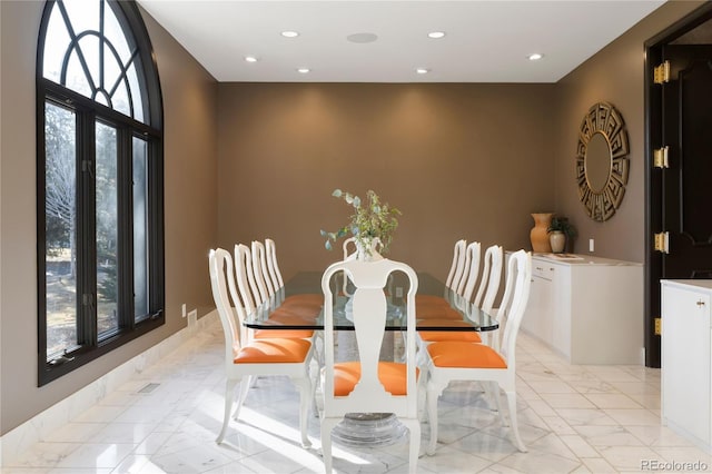 9 Sedgwick Dr, Englewood, CO 80113 - dining area with healthy amount of natural light, light marble finish flooring, and recessed lighting