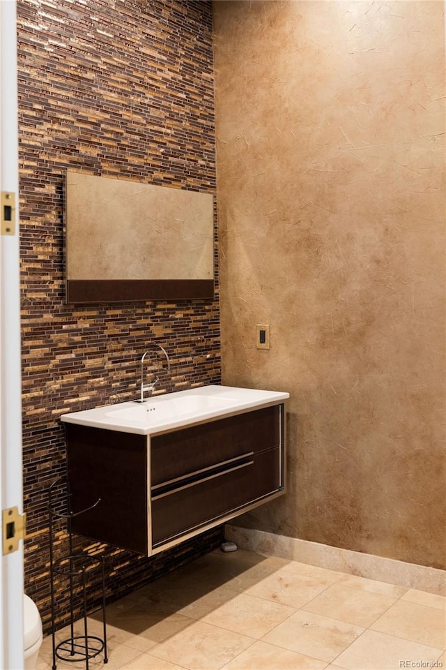 9 Sedgwick Dr, Englewood, CO 80113 - bathroom featuring vanity and tile patterned flooring