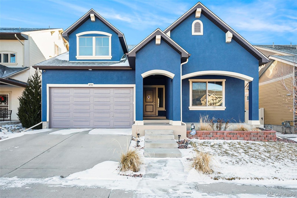 view of front of property featuring a garage