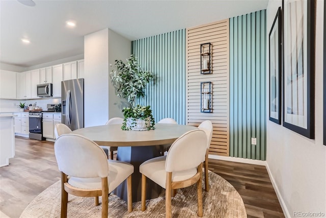 14151 Deertrack Ln, Parker, CO 80134 - dining area featuring baseboards, wood finished floors, and recessed lighting