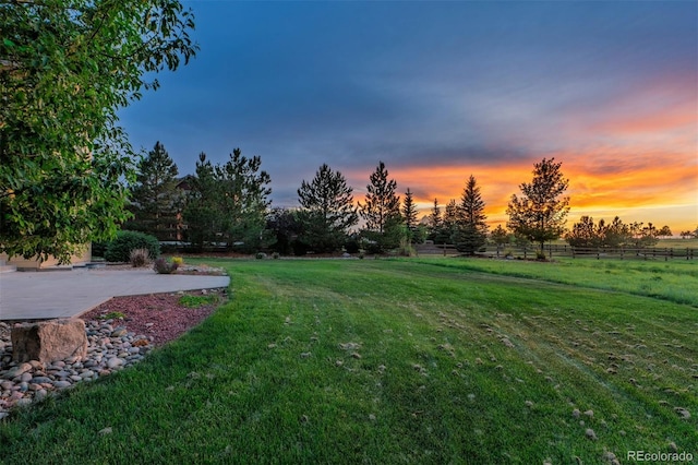 5605 Killen Ave, Castle Rock, CO 80104 - yard at dusk featuring a patio and a view of countryside