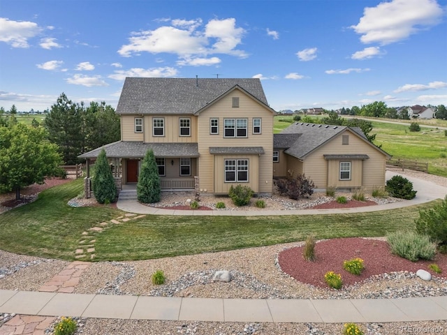 5605 Killen Ave, Castle Rock, CO 80104 - traditional-style home featuring covered porch, a front lawn, and a shingled roof