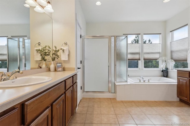 5605 Killen Ave, Castle Rock, CO 80104 - full bath featuring vanity, a garden tub, a shower stall, tile patterned flooring, and recessed lighting