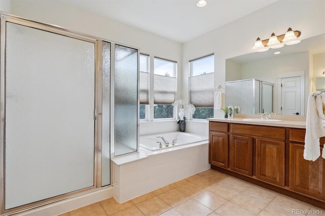 5605 Killen Ave, Castle Rock, CO 80104 - bathroom with vanity, a stall shower, tile patterned floors, a bath, and recessed lighting