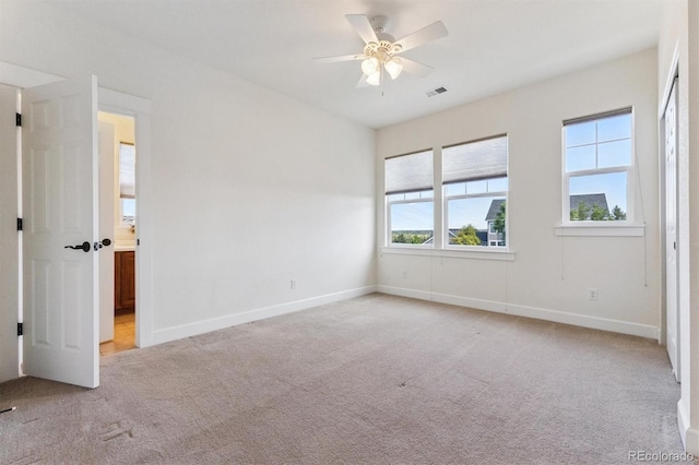 5605 Killen Ave, Castle Rock, CO 80104 - unfurnished bedroom with light carpet, ensuite bathroom, and ceiling fan