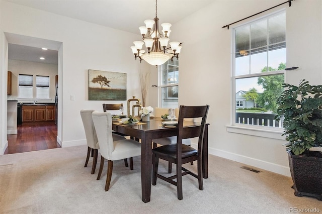 5605 Killen Ave, Castle Rock, CO 80104 - carpeted dining area featuring a chandelier and recessed lighting