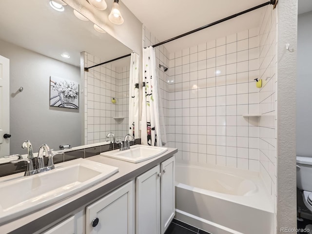 full bathroom with shower / bath combo, vanity, tile patterned floors, and toilet