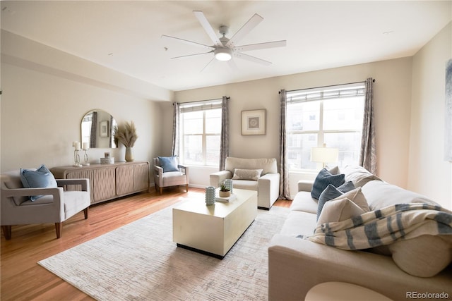 451 S Reed St, Lakewood, CO 80226 - living area with light wood-type flooring and ceiling fan