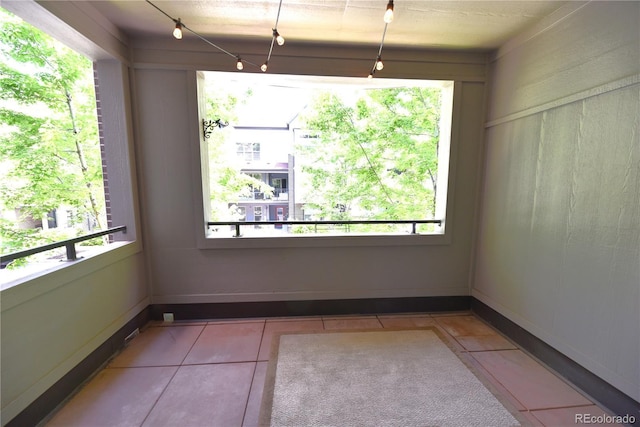 451 S Reed St, Lakewood, CO 80226 - tiled spare room with plenty of natural light