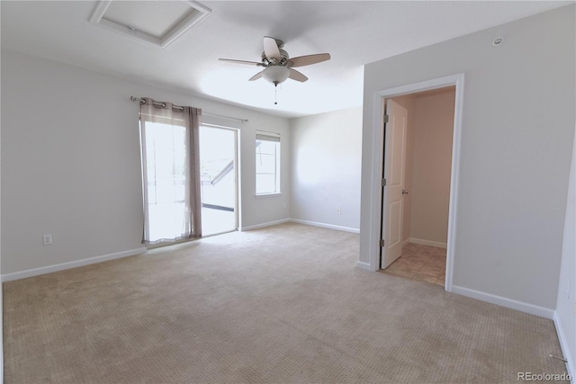 451 S Reed St, Lakewood, CO 80226 - empty room with attic access, light colored carpet, ceiling fan, and baseboards