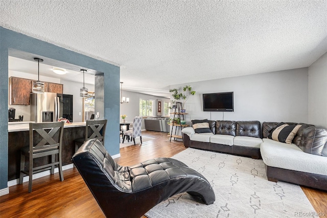 4844 E 110th Pl, Thornton, CO 80233 - living area featuring wood finished floors and a textured ceiling