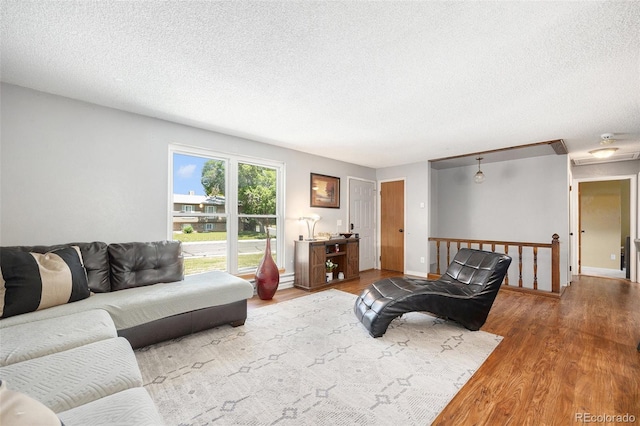 4844 E 110th Pl, Thornton, CO 80233 - living area featuring wood finished floors and a textured ceiling