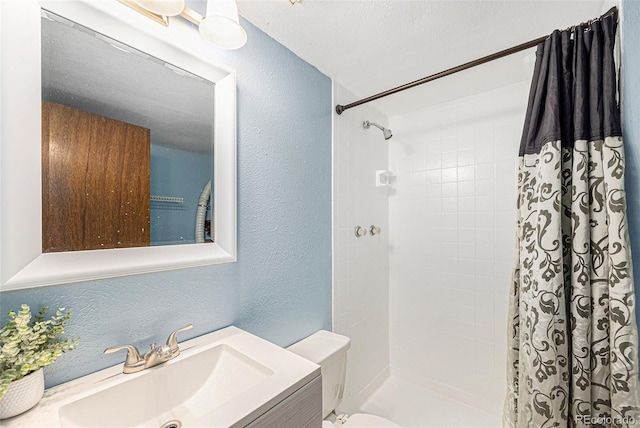4844 E 110th Pl, Thornton, CO 80233 - bathroom with a textured wall, a tile shower, and vanity