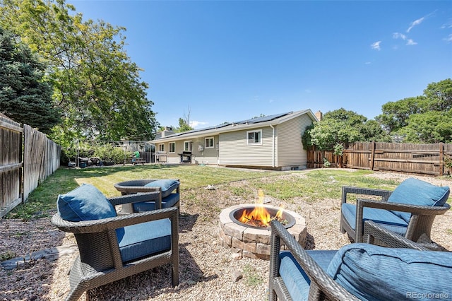 4844 E 110th Pl, Thornton, CO 80233 - fenced backyard with a fire pit and a patio area