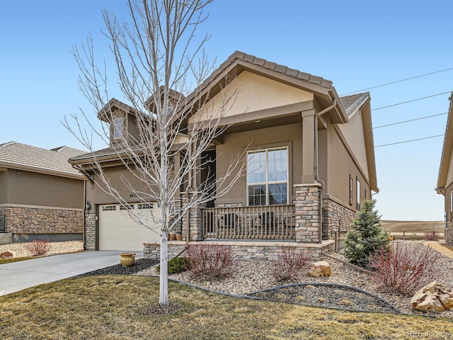 view of front of house with concrete driveway, covered porch, stone siding, and stucco siding