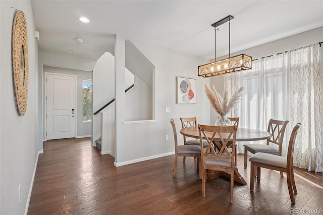 18079 E 108th Pl, Commerce City, CO 80022 - dining area with baseboards, stairway, a chandelier, dark wood-style flooring, and recessed lighting