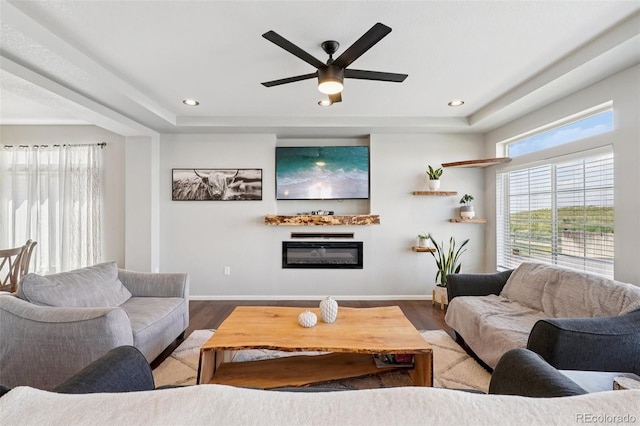 18079 E 108th Pl, Commerce City, CO 80022 - living room with wood finished floors, ceiling fan, baseboards, a glass covered fireplace, and recessed lighting