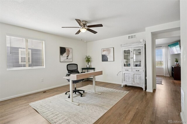 18079 E 108th Pl, Commerce City, CO 80022 - office space featuring ceiling fan, wood finished floors, and baseboards
