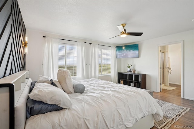 18079 E 108th Pl, Commerce City, CO 80022 - bedroom with wood finished floors, baseboards, and a ceiling fan