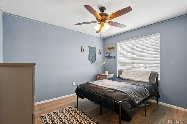 18079 E 108th Pl, Commerce City, CO 80022 - bedroom with wood finished floors, baseboards, and a ceiling fan