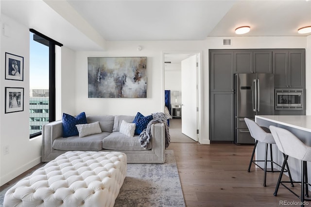 living room with dark hardwood / wood-style floors