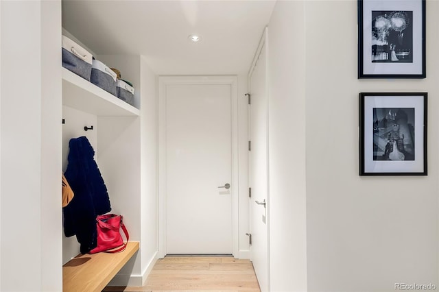 mudroom with light hardwood / wood-style flooring