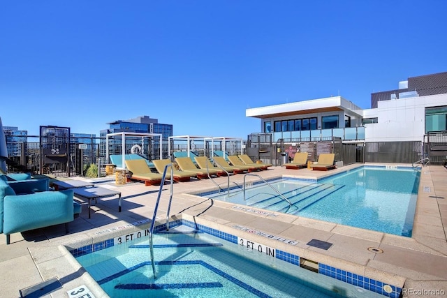 view of swimming pool with a patio