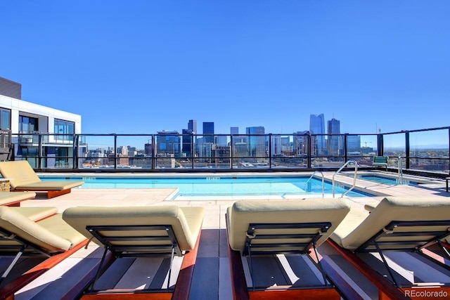 view of pool with a jacuzzi