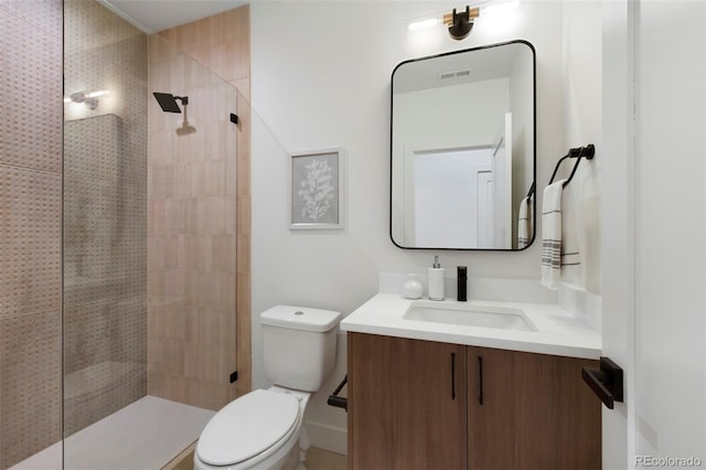 2450 S Cherokee St, Denver, CO 80223 - bathroom with toilet, vanity, and tiled shower