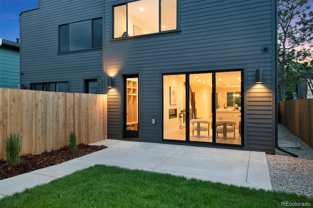 2450 S Cherokee St, Denver, CO 80223 - rear view of property featuring a patio area