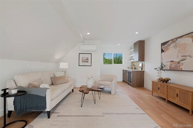 2450 S Cherokee St, Denver, CO 80223 - living area featuring a wall mounted air conditioner, light wood-style floors, recessed lighting, and baseboards