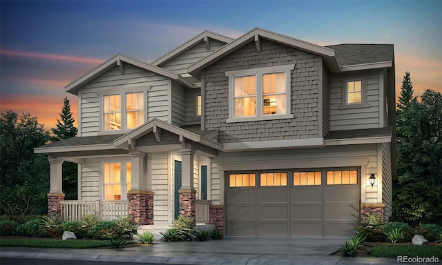 craftsman-style house featuring covered porch and a garage