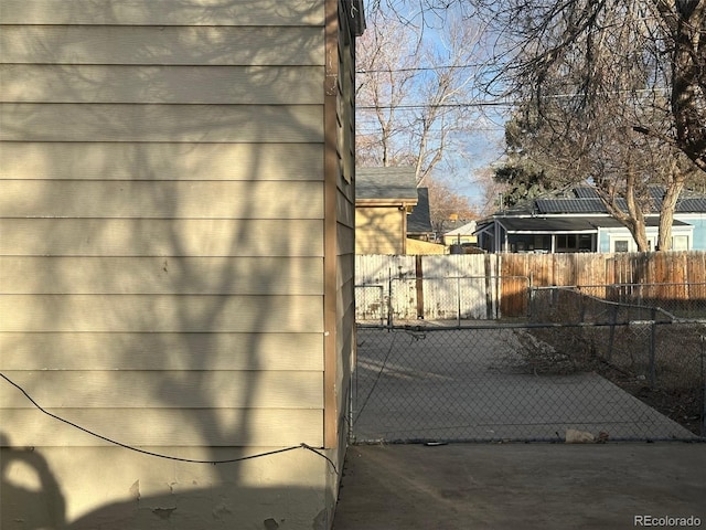 view of gate featuring fence