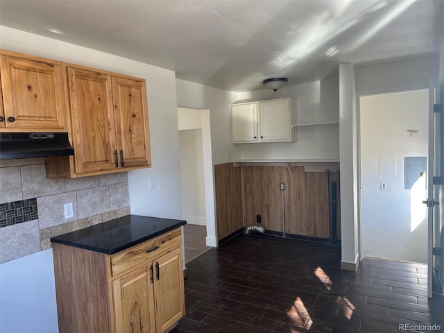 kitchen featuring open shelves, baseboards, wood finish floors, backsplash, and under cabinet range hood