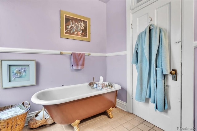 bathroom featuring tile patterned floors and a bath