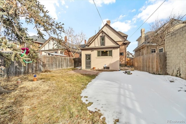 rear view of house with a yard