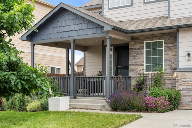 4626 Dancing Rain Way, Colorado Springs, CO 80911 - property entrance with roof with shingles, a porch, and stone siding
